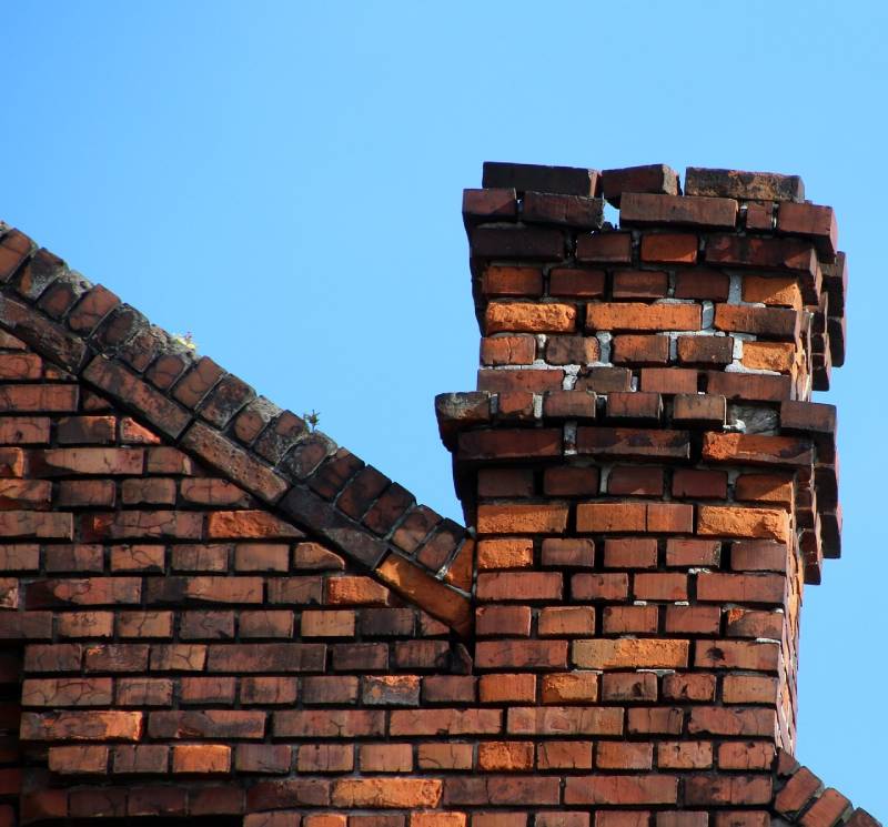 Signs Your Rosemead Home Needs a Chimney Inspection Damaged chimney on an Rosemead home showing cracks and missing mortar